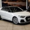 Audi A1 Sportback 30 TFSI Advanced S Tronic in a sleek urban setting, showcasing its modern design and features.