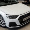 Audi A1 Sportback 30 TFSI Advanced S Tronic in a sleek urban setting, showcasing its modern design and features.